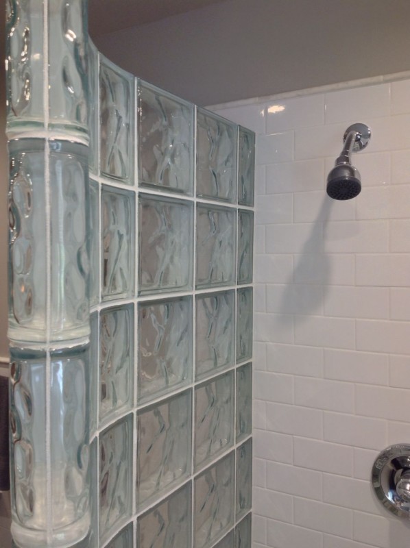 Curved glass block shower wall with white subway tile in columbus ohio