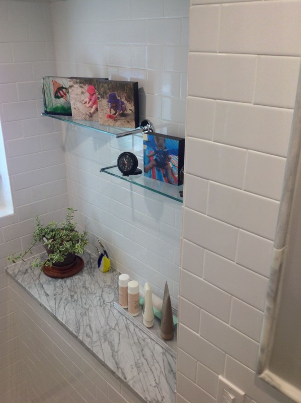 Shower alcove with white subway tile provides a decorative nook for a guest bathroom in Lancaster ohio