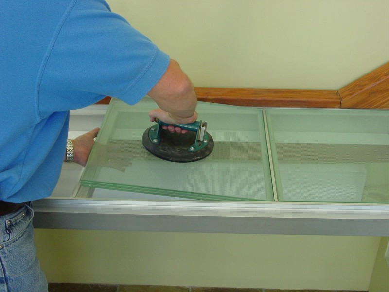 Laminated glass floor panel being installed 