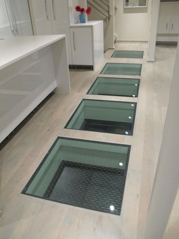 glass panels with a glass frit top surface for traction in a luxury home 