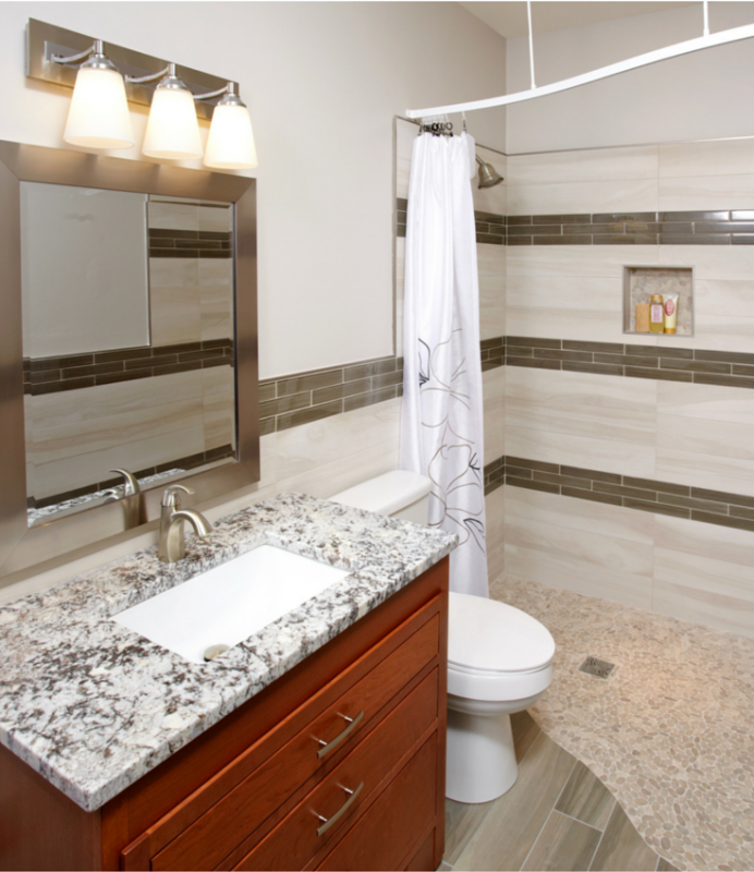 One level wet room bathrom in a 5' x 7' small bath space using a wet room system. Love how the tile spills out onto the bathroom floor. | Innovate Building Solutions 