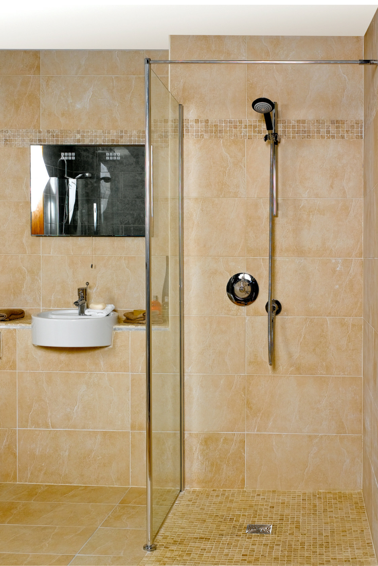 Hand held shower in a one level curbless walk in shower | Innovate Building Solutions