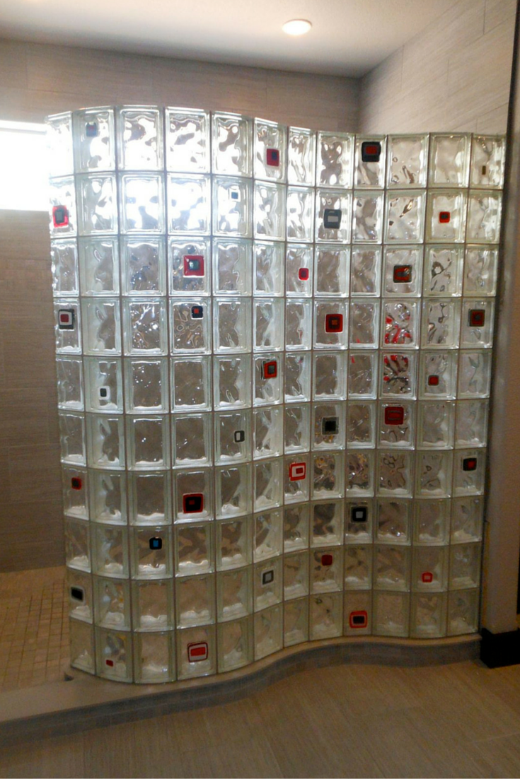 serpentine glass block wall on a ready for tile shower pan with some colored tiles added on | Innovate Building Solutions 