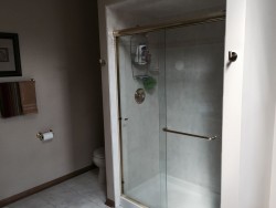 Before picture of Orland Park bathroom before renovation with framed shower enclosure