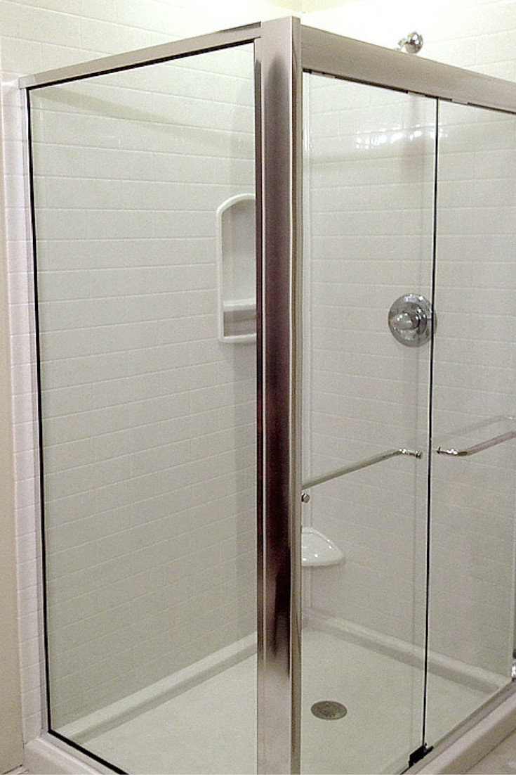 White subway tile shower made using waterproof stone solid surface wall panels 