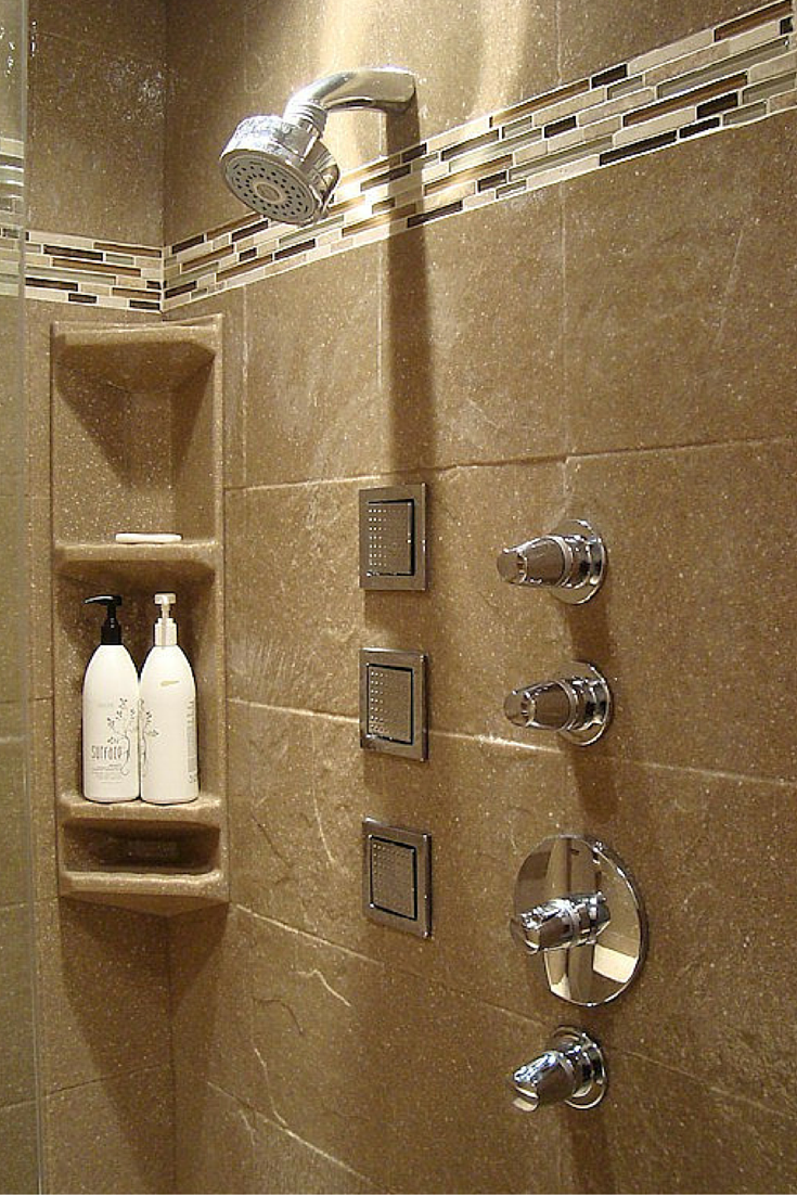 Stone solid surface corner caddies in a 12 x 12 stone tile pattern shower wall panel system 