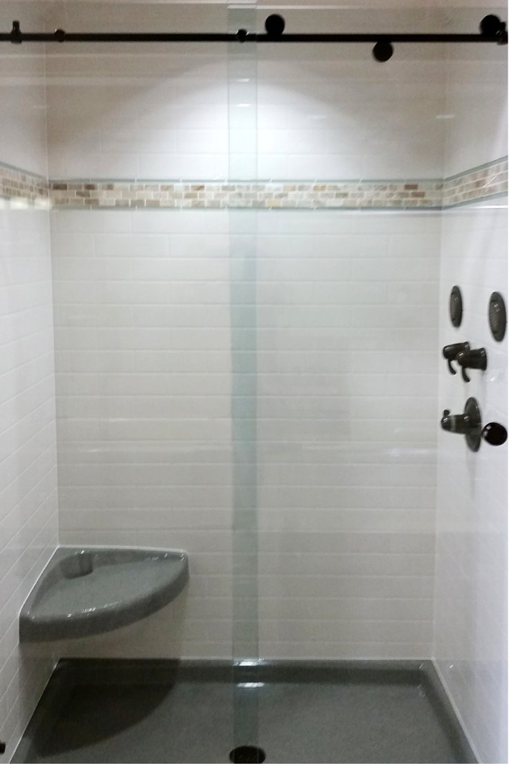 Traditional subway tile shower wall panel sytem made out of stone solid surface