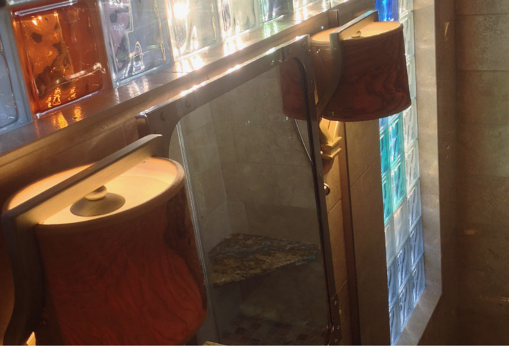 Recycled burl wood bathroom vanity lighting fixture in an upscale remodel in columbus ohio 