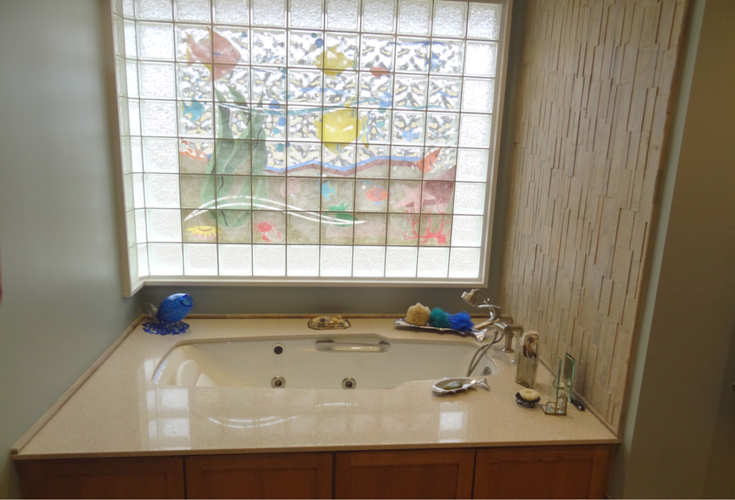 A transfer station tub area for an active adult bathroom 