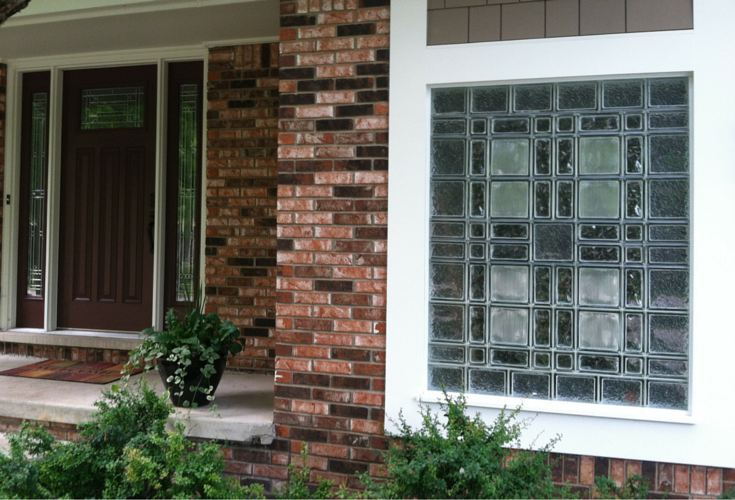 Craftsman style entry door with multi-sized glass block garage window in Michigan 