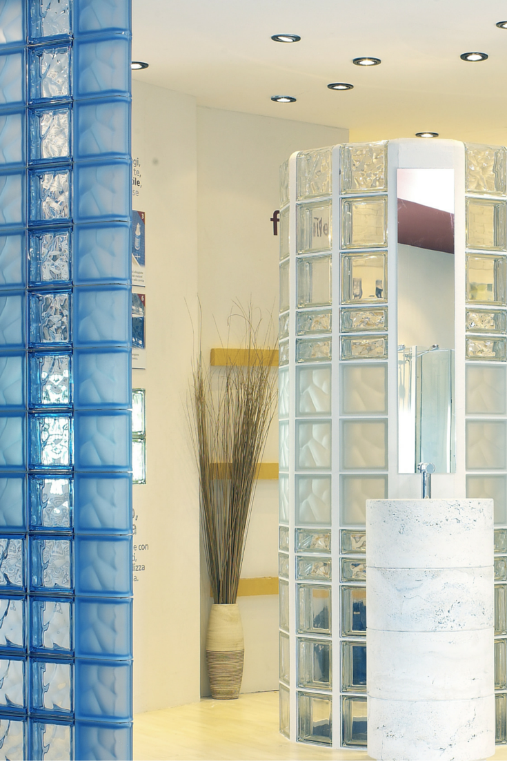 Glass block walls with various patterned and blue and clear colored glass blocks 