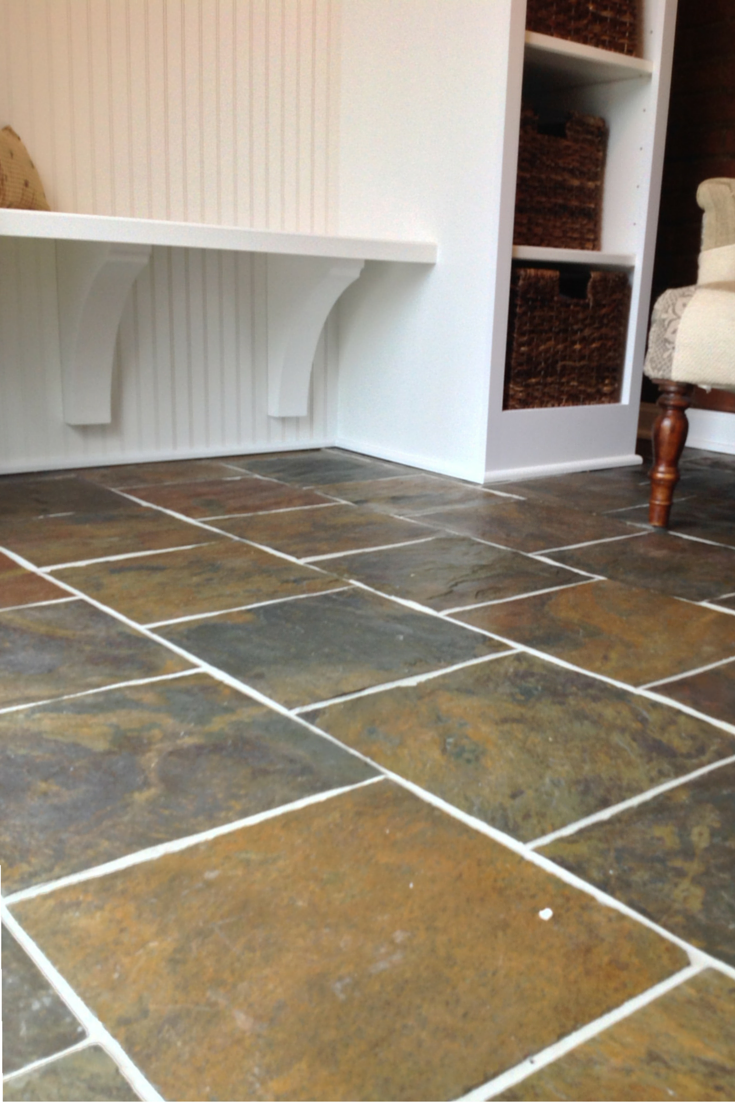 An entryway mud room bench seat supported by corbels in university heights ohio