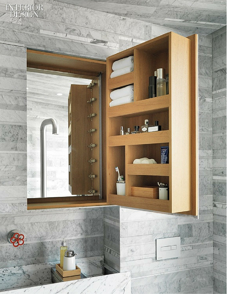 Custom made bathroom medicine cabinet with compartments for towels toothbrushes and toiletries