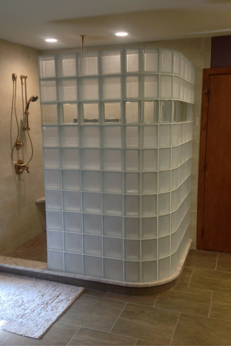 glass block shower in columbus with high privacy frosted glass blocks and a clear row to see through 