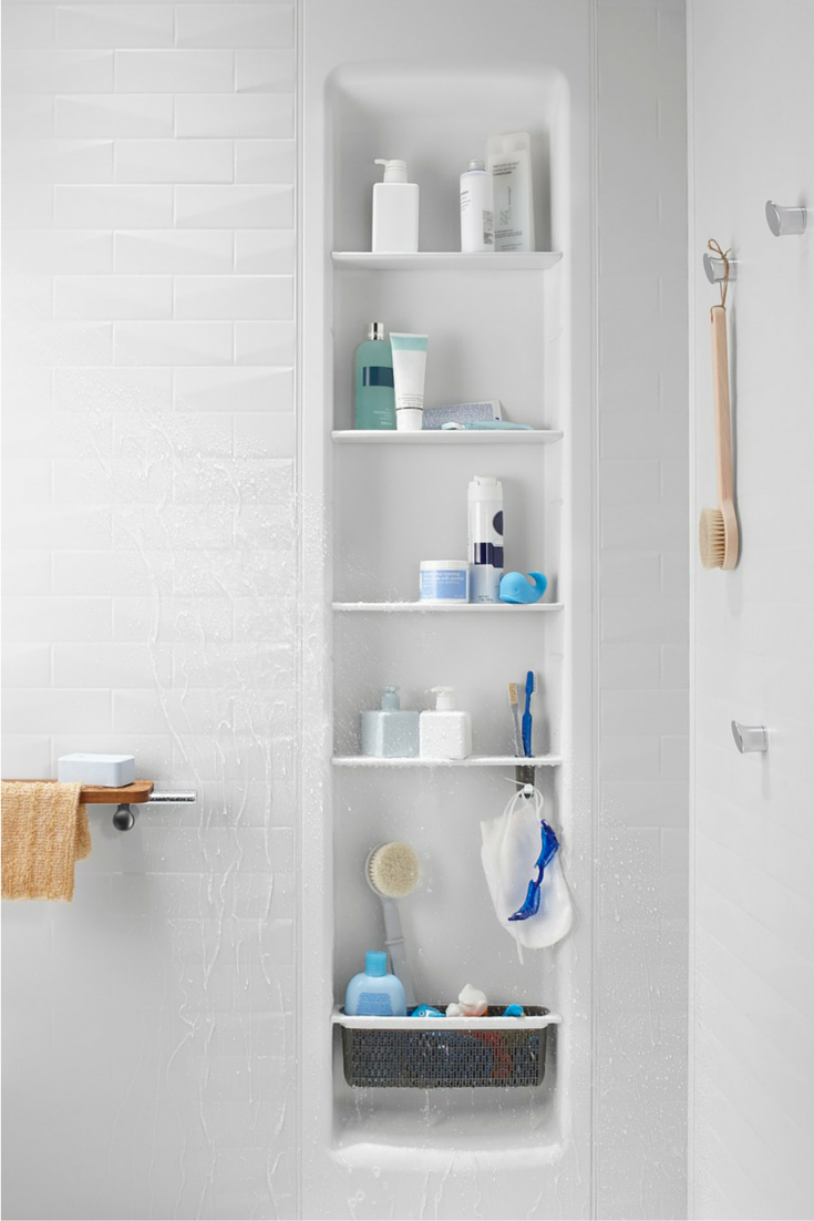 A recessed shower locker or niche in a grout free shower wall panel system