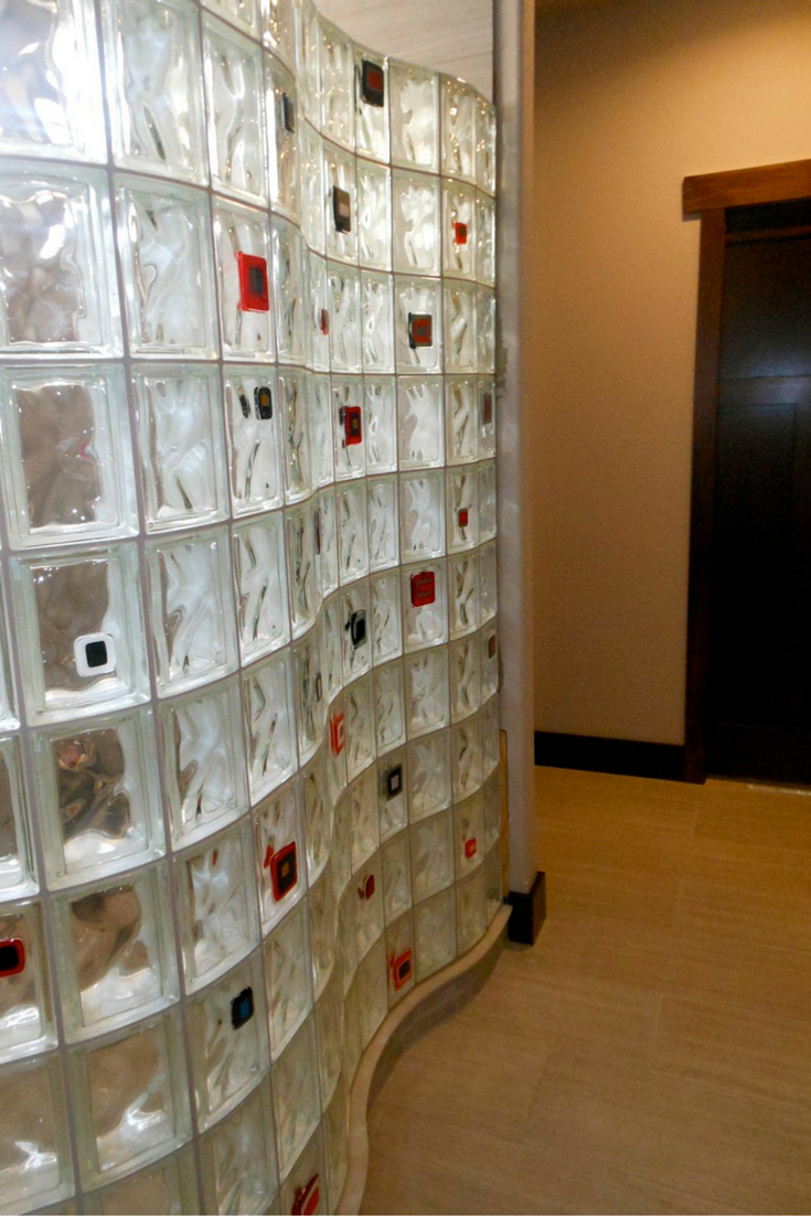 Serpentine shaped glass block shower wall with glass tile decorative accents in Rapid City South Dakota 