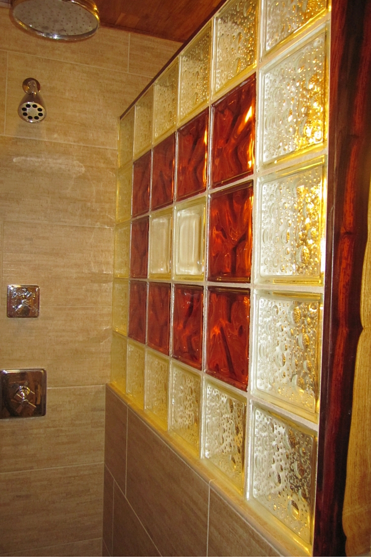 Cocobolo wood trim for a unique design glass block shower wall using icescapes and decora pattern glass blocks 