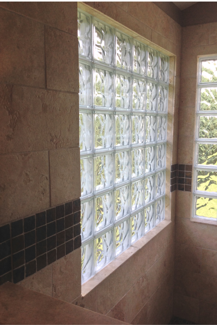 Glass block shower window lined on the inside with ceramic tile 