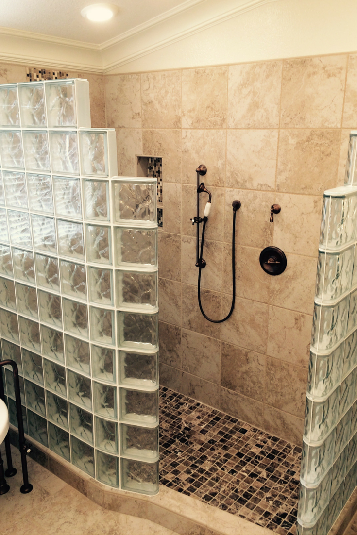 Walk in glass block shower with a curved and straight step down wall | Innovate Building Solutions 