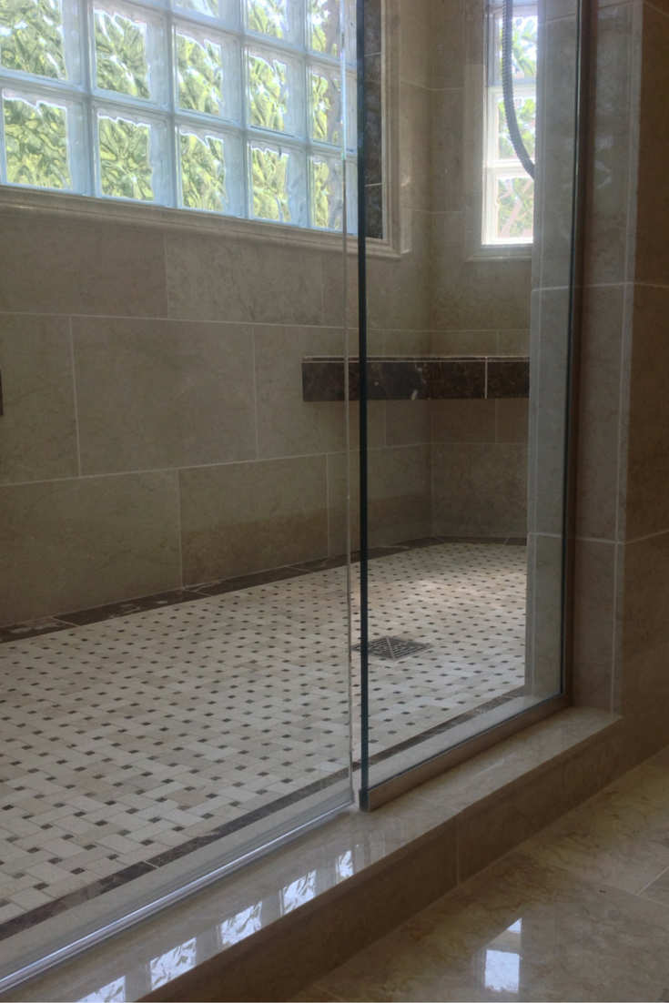 heated tile and marble floors in a jack and jill bathroom