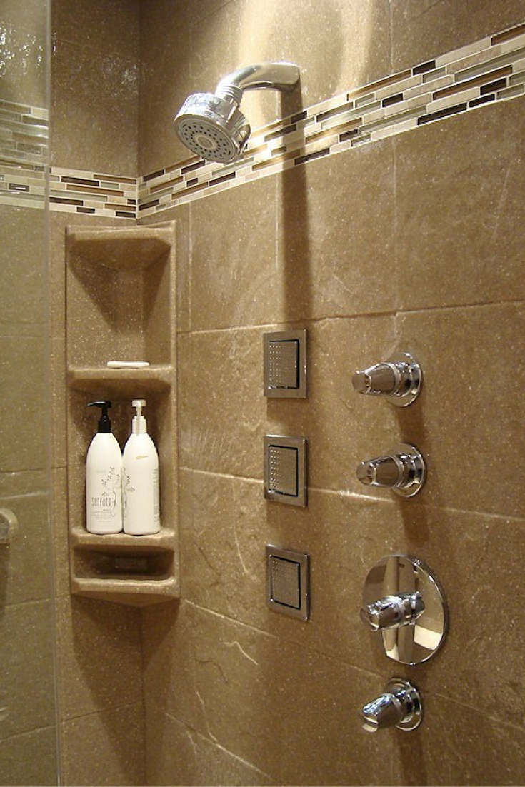 Textured solid surface shower wall panels with a decorative border