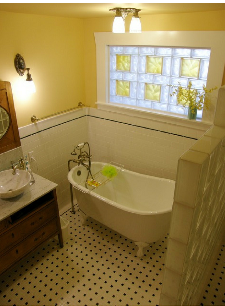 Mixed glass block sizes with ambered colored glass blocks in a traditional bathroom | Innovate Building Solutions 