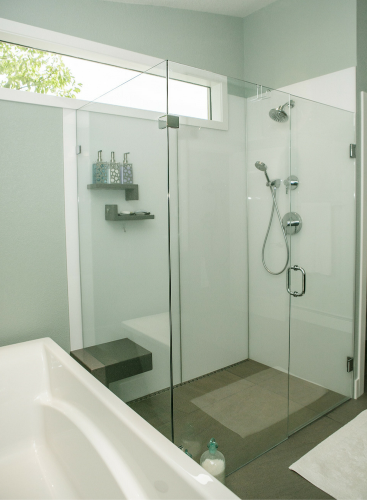 Glacier colored high gloss wall panels in a minimalist Euro inspired bathroom 