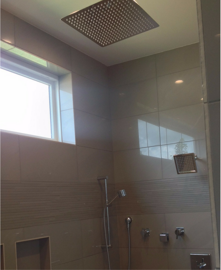 Multiple shower heads in a tile shower in Columbus for a spa type experience