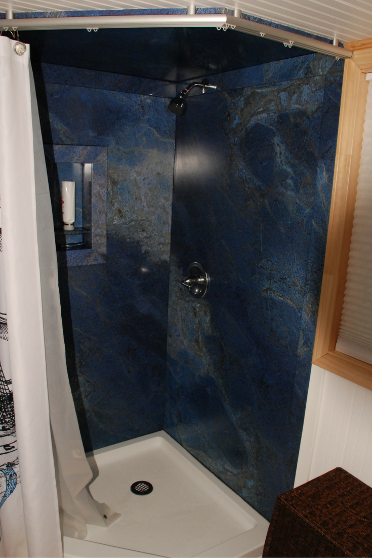 decorative diy shower wall panels in a custom tiny home 