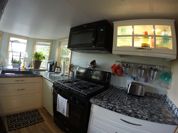 LED lighting in upper cabinets in a tiny home kitchen 