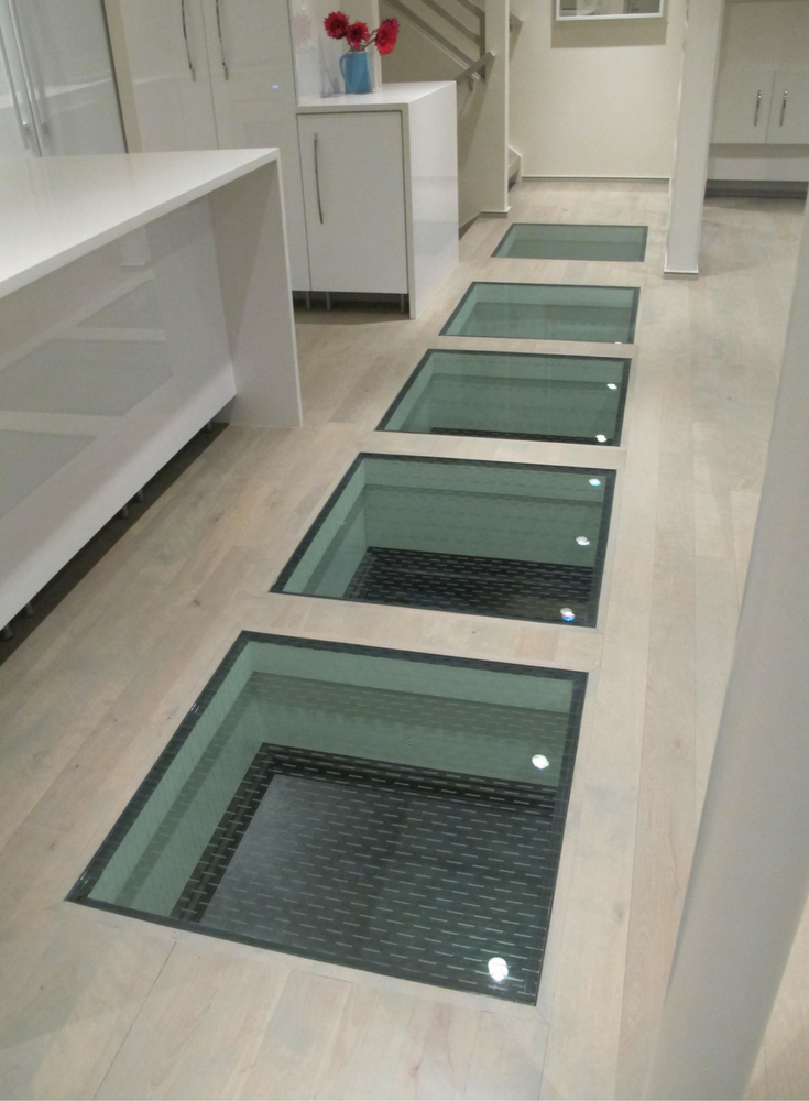 Ceramic glass frit for anti-slip traction control in a glass floor project in Kansas City Missouri. 