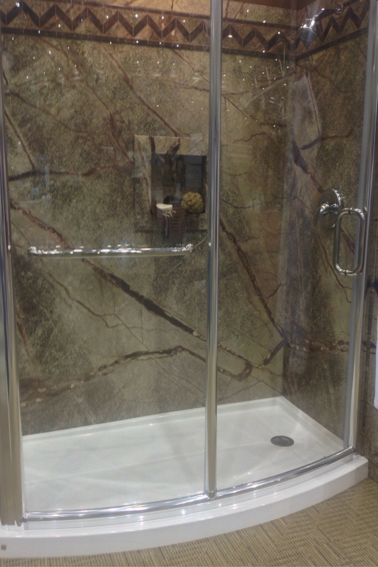 With a DIY shower kit make sure to consider getting a matching glass enclosure with which goes with a shower pan. This curved acrylic shower pan is designed to fit the frameless curved glass wall. Innovate Building Solutions 