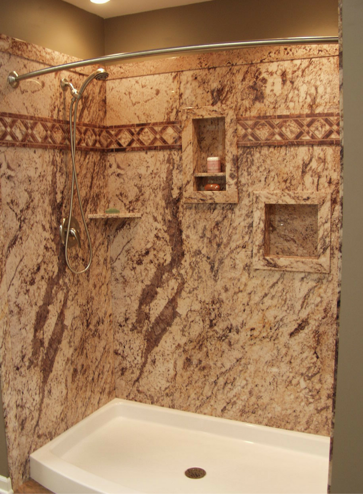 Don't forget shower storage in a DIY shower kit. Recessed niches shown in this faux marble wall panel system provide more storage. Innovate Building Solutions 