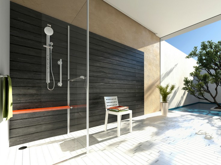 Floor to ceiling glass in a modern bathroom with a privacy courtyard provides lots of light - yet privacy to an upscale bathroom. | Innovate Building Solutions 