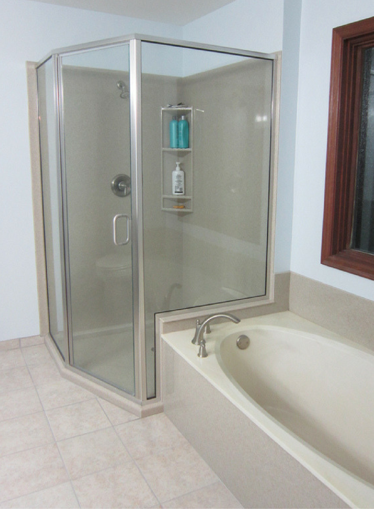 Angled custom solid surface shower enclosure and wall panels | Innovate Building Solutions 