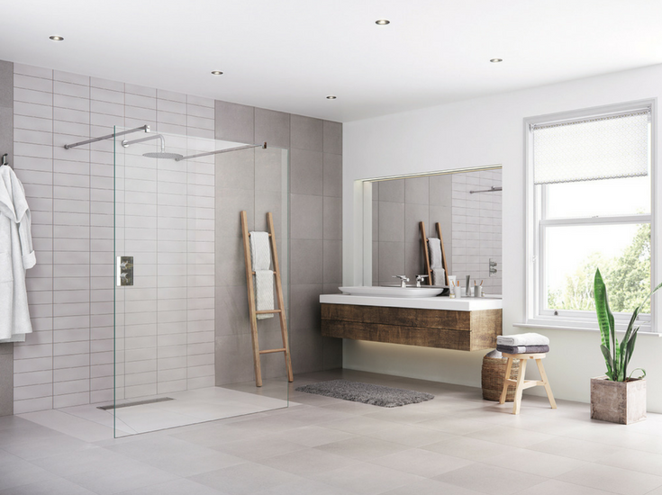 Large format tiles used in an accessible one level bathroom | Innovate Building Solutions 