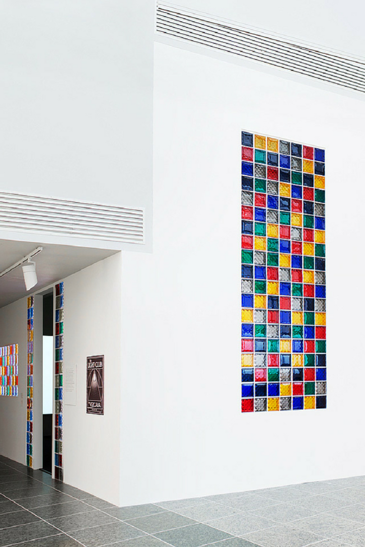 Multi colored glass block window in a minimalist luxury home | Innovate Building Solutions 