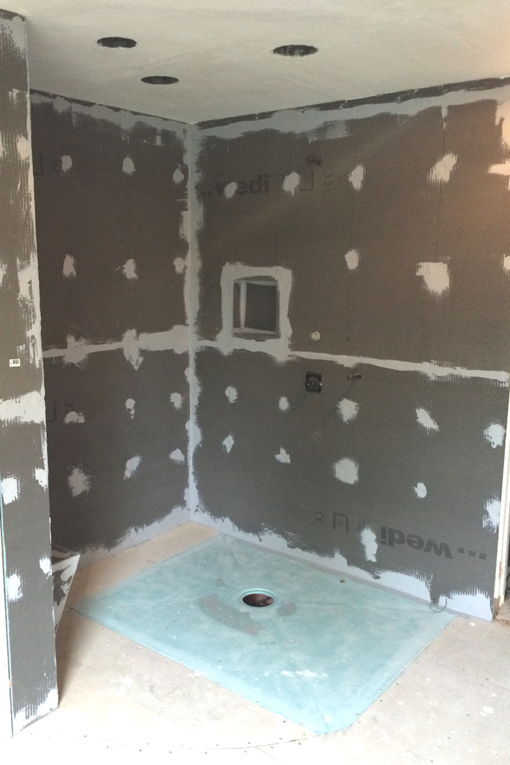 One level wet room shower pan during the installation process in a Cleveland Ohio bath remodeling project | Cleveland Design and Remodeling divison of Innovate Building Solutions 