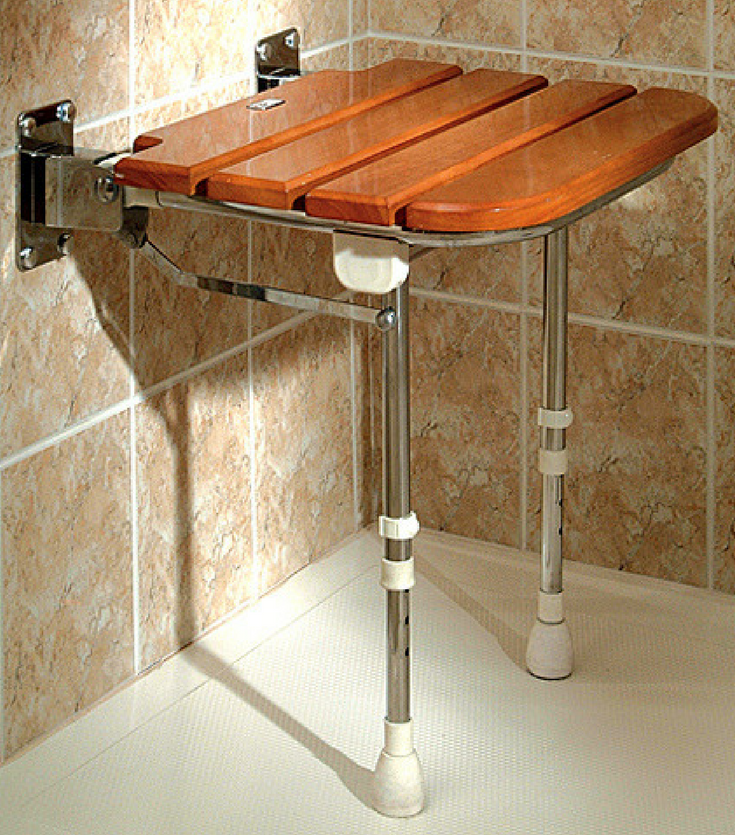 Teak fold down seat provides seating in a tub to shower conversion project | Innovate Building Solutions