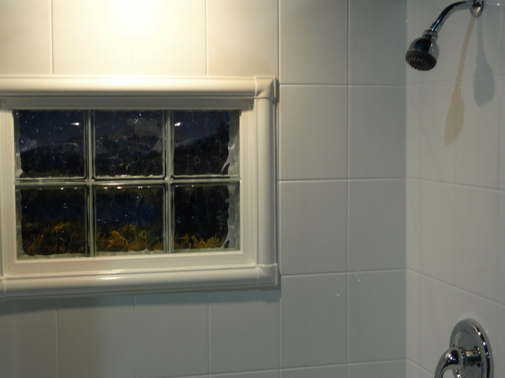 Acrylic window trim kit in a shower | Innovate Building Solutions 