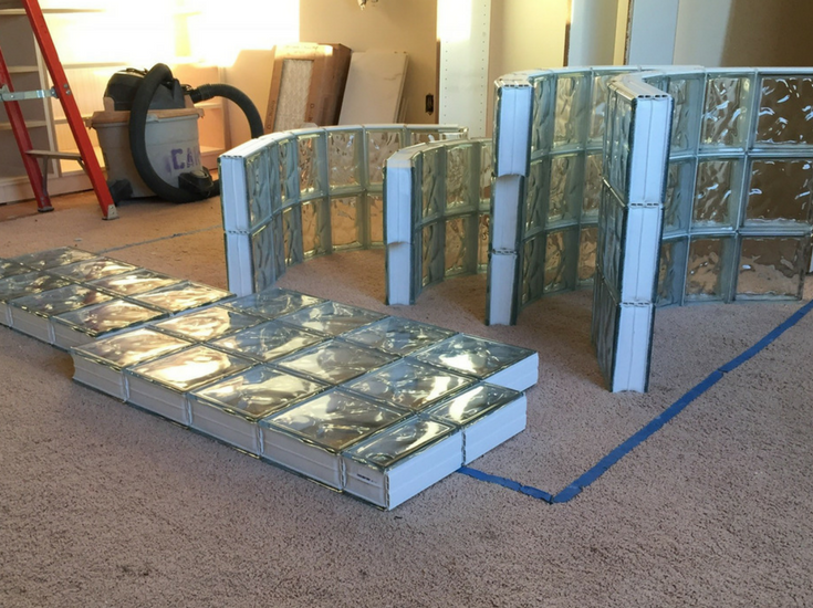 Prefabricated glass block sections for a curved walk in shower before installation - Innovate Building Solutions 