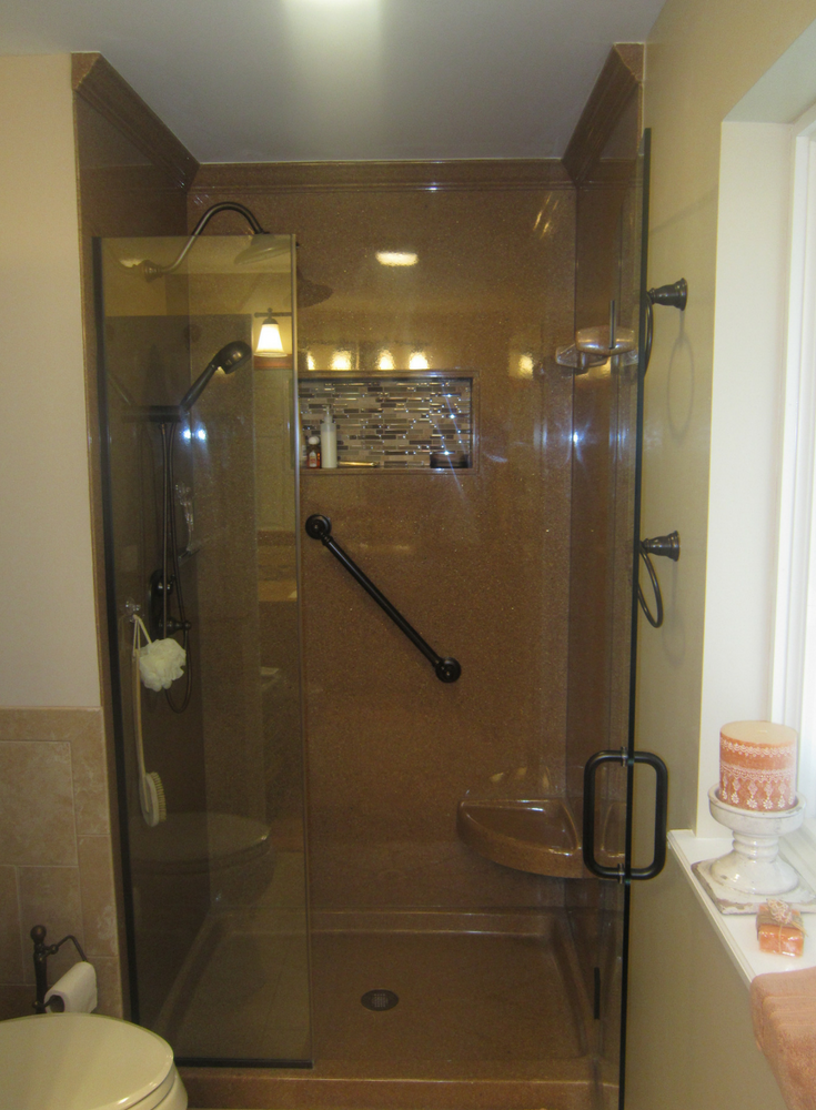 Solid surface crown molding in a stand up shower stall | Innovate Building Solutions 