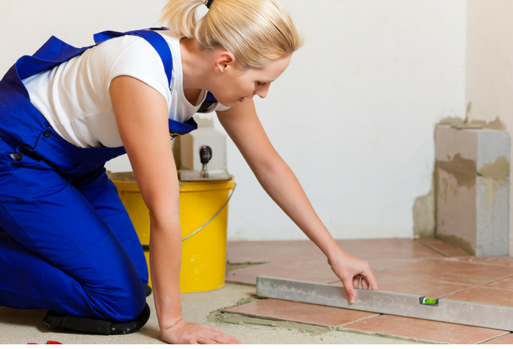 DIY homeowner doing a shower tile floor installation | Innovate Buildinig Solutions 
