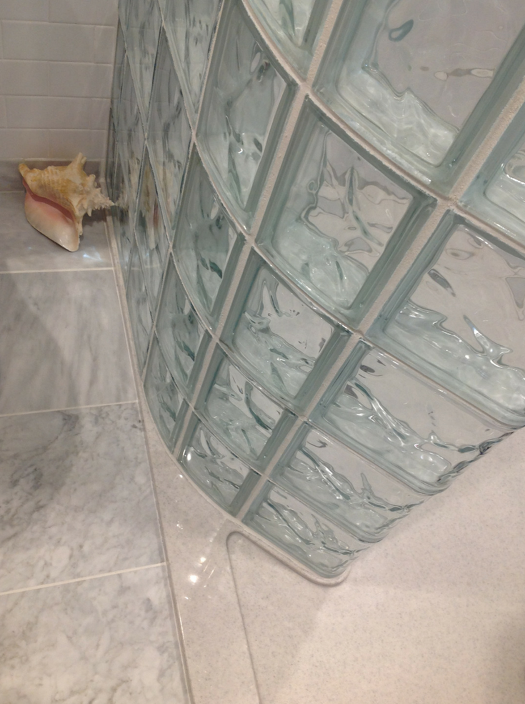 A curved glass block shower and a solid surface shower pan are durable and low maintenance. They are excellent products for your contractor to install because they won't have call backs. | Innovate Building Solutions