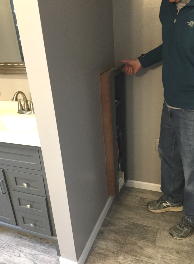 A custom made DIY pull out bathroom bookcase to allow access to the plumbing behind a bathroom vanity | Innovate Building Solutions 