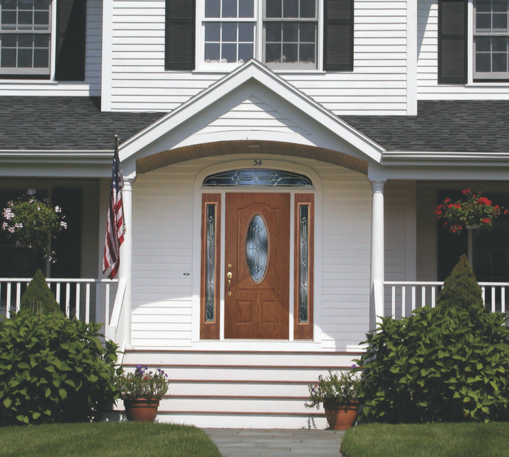 A remodeled home with white vinyl siding and new replacement entry door and windows | Innovate Building Solutions Cleveland Ohio