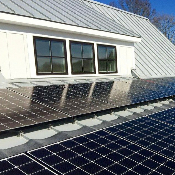 Silver gray metal roof in a sustainable energy efficient modern farmhouse in Connecticut | Innovate Building Solutions