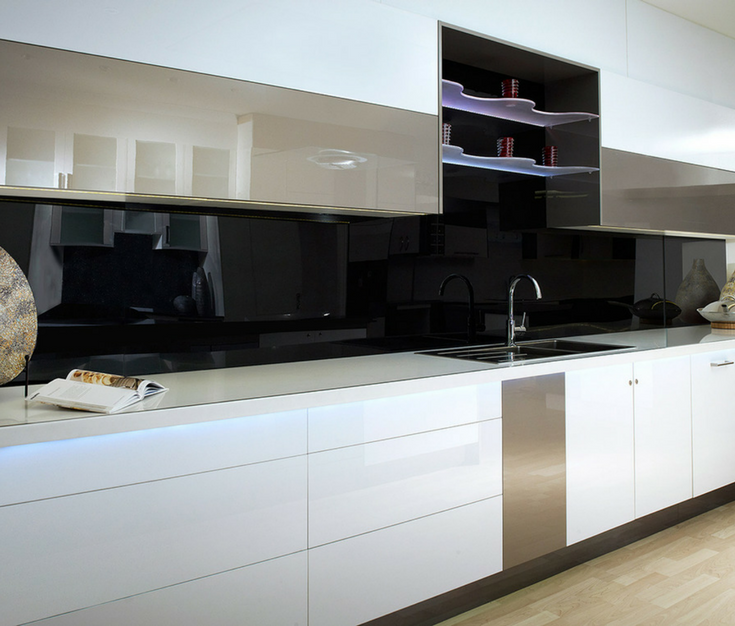 A black colored high gloss acrylic wall panel kitchen backsplash creates a sleek contemporary look | Innovate Building Solutions 