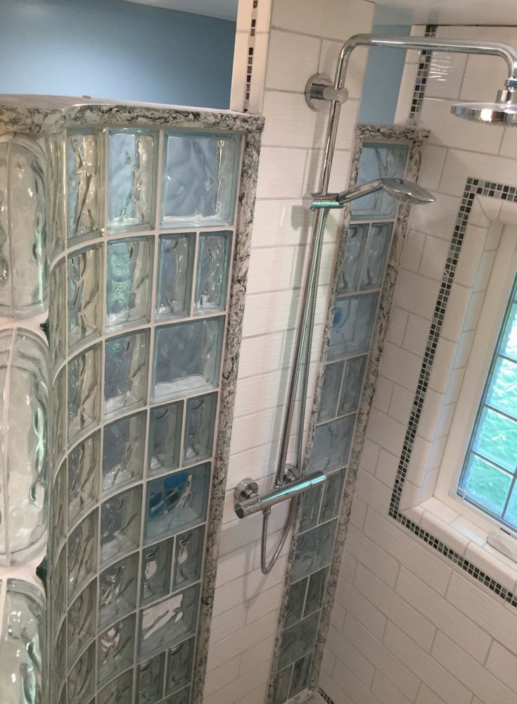 Decorative Cambria quartz sands color shower cap to finish off a curved walk in glass block wall | Innovate Building Solutions 