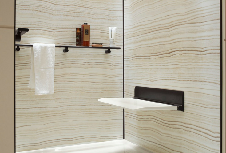 Grout free decorative shower wall panels with a fold down seat for an accessible shower - Innovate Building Solutions